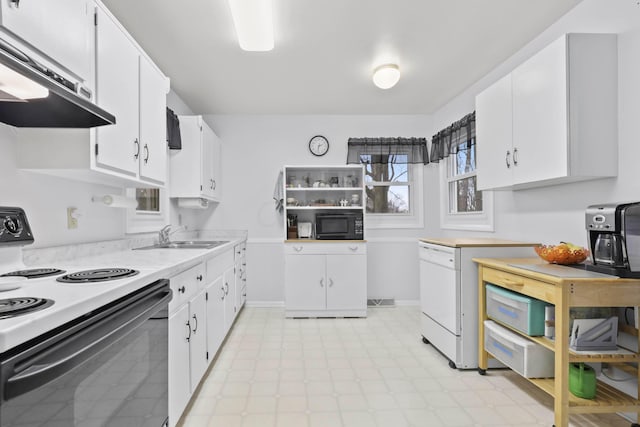 kitchen with white range with electric cooktop, sink, and white cabinets