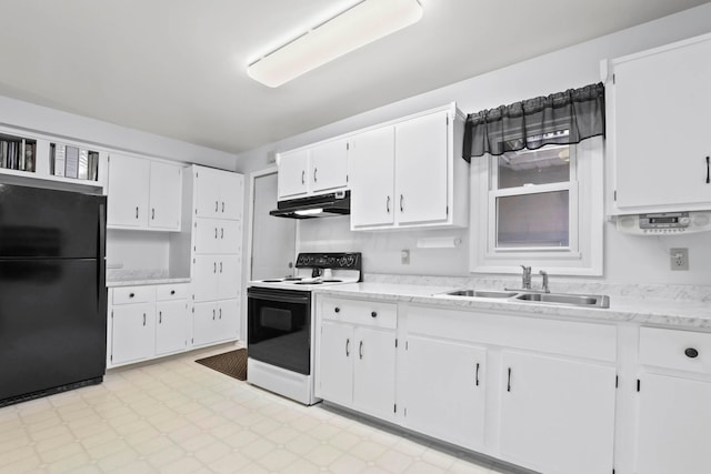 kitchen with black refrigerator, white electric range, white cabinetry, and sink