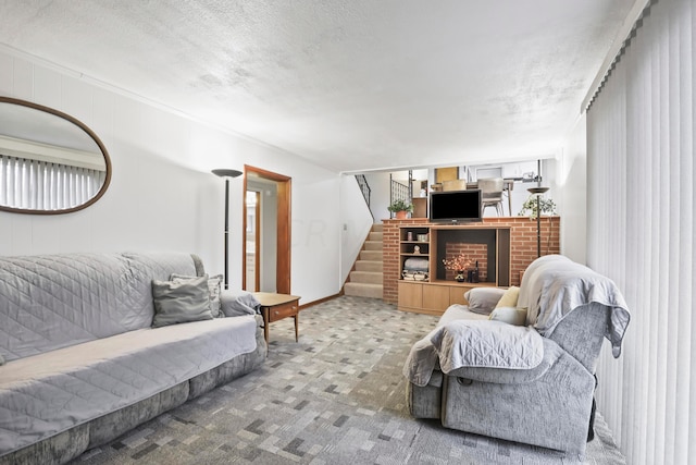 carpeted living room with a fireplace and a textured ceiling