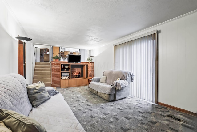 carpeted living room featuring a textured ceiling and ornamental molding