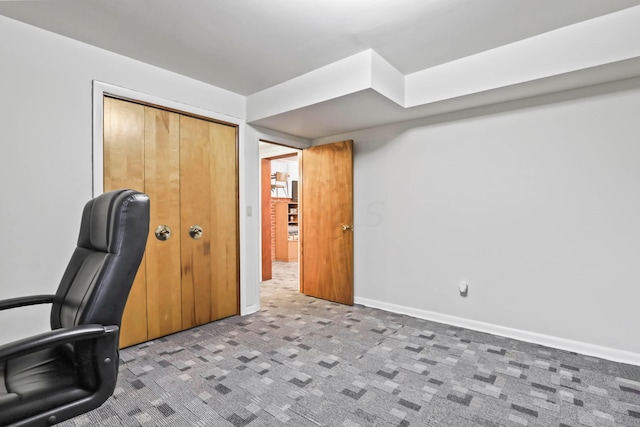 unfurnished office featuring carpet flooring