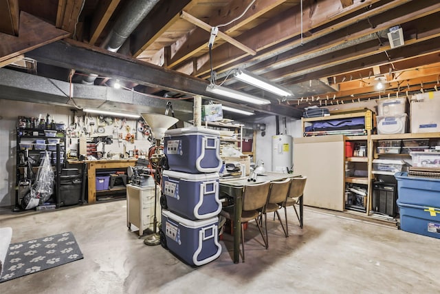 basement featuring a workshop area and water heater