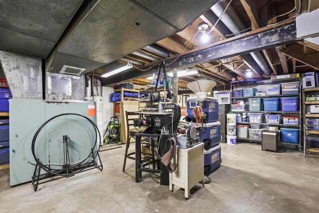 basement featuring electric water heater