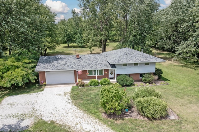 view of front of home featuring a front lawn and a garage