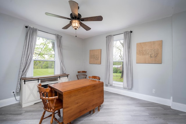 dining space featuring hardwood / wood-style floors and ceiling fan