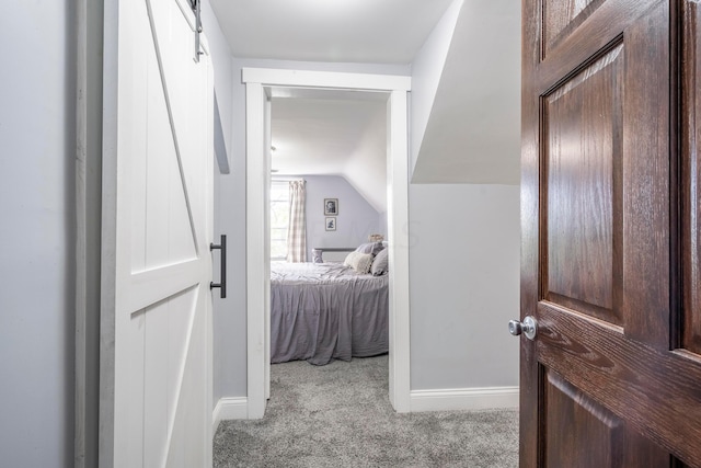 carpeted bedroom featuring lofted ceiling