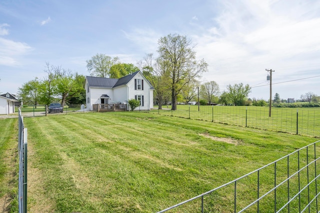 view of yard with a rural view