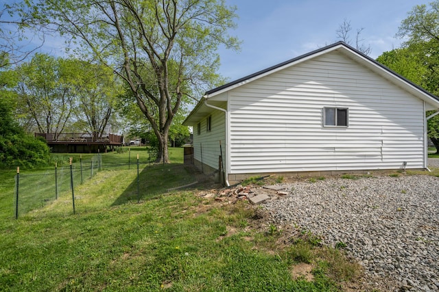 view of side of home with a lawn