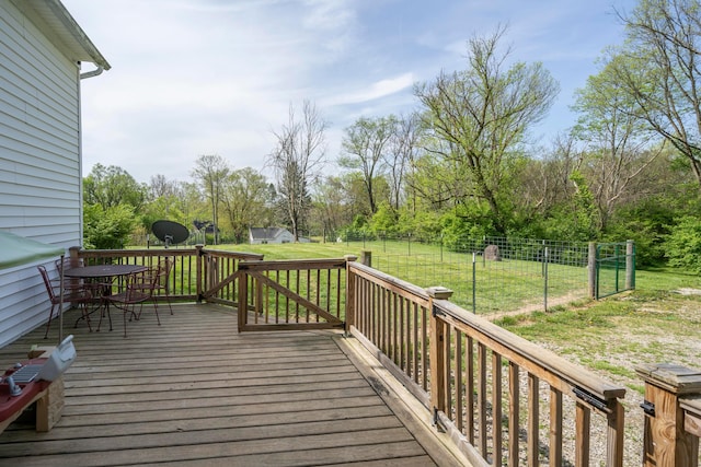 wooden deck with a lawn