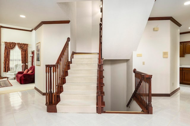 stairway featuring tile patterned flooring and ornamental molding