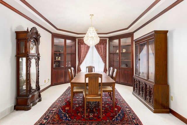 carpeted dining area featuring crown molding and a notable chandelier