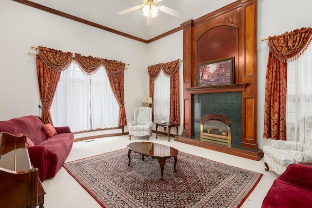 sitting room with plenty of natural light, carpet, and ornamental molding