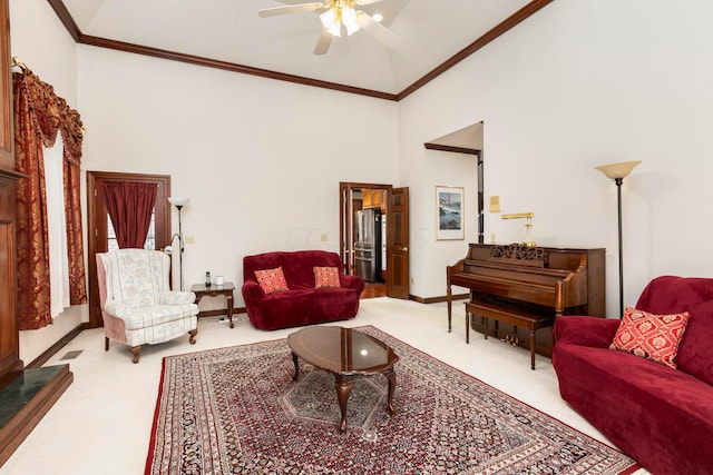 living room featuring carpet, high vaulted ceiling, ceiling fan, and ornamental molding