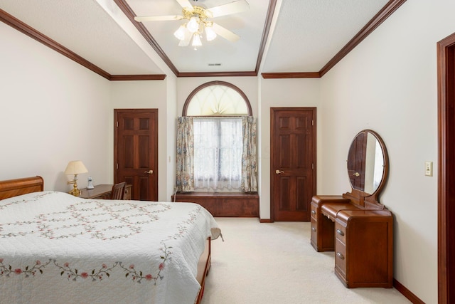 carpeted bedroom with ceiling fan, ornamental molding, and a textured ceiling