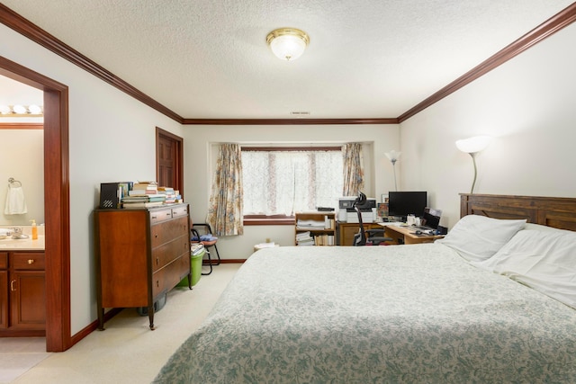 carpeted bedroom featuring a textured ceiling, ensuite bathroom, crown molding, and sink