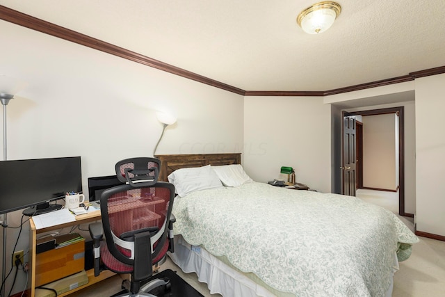 carpeted bedroom with a textured ceiling and ornamental molding