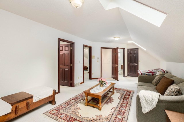 carpeted living room featuring vaulted ceiling