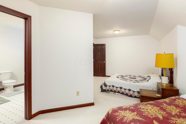 carpeted bedroom featuring vaulted ceiling