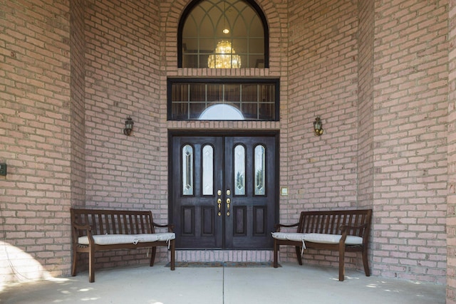 view of exterior entry featuring french doors