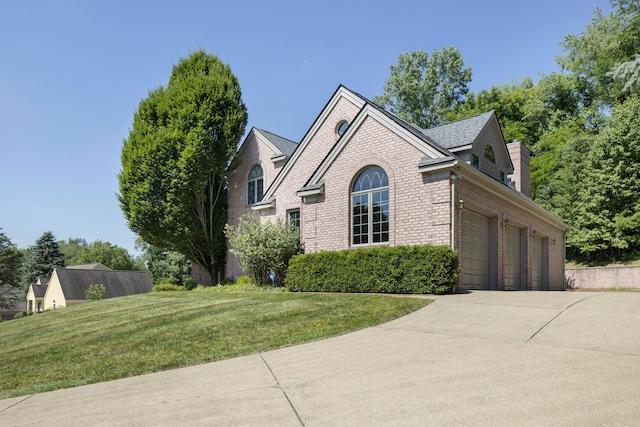 view of front facade with a front yard and a garage