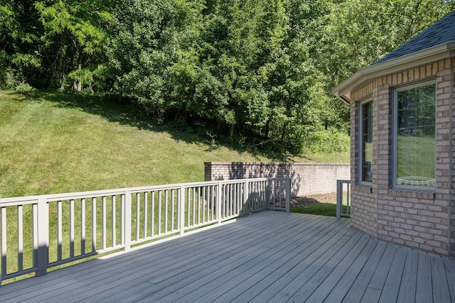 wooden deck with a lawn