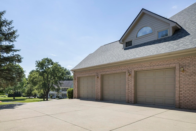 view of side of property with a garage