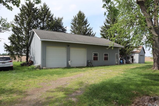 garage with a lawn