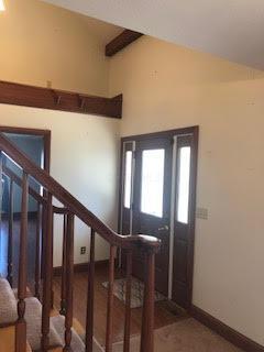 foyer entrance with lofted ceiling