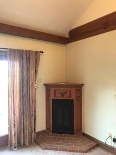 unfurnished living room with lofted ceiling