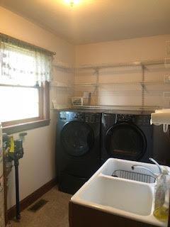 laundry room with washing machine and dryer