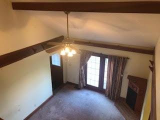 bonus room with lofted ceiling with beams, ceiling fan, and dark carpet