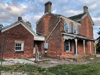 back of house with a porch