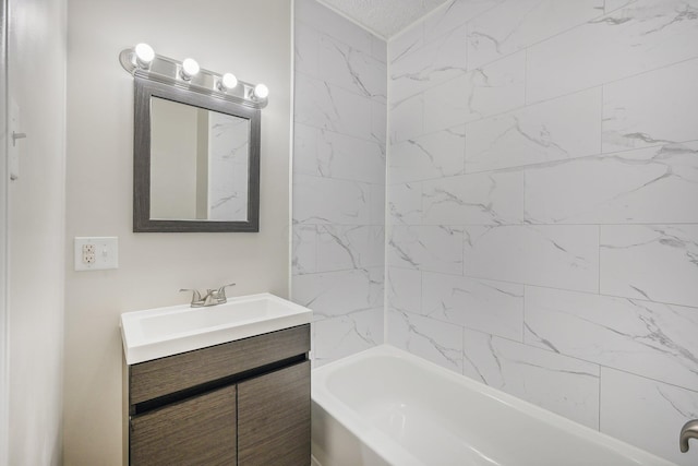 bathroom featuring vanity and tiled shower / bath combo