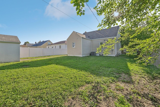 view of yard with central AC