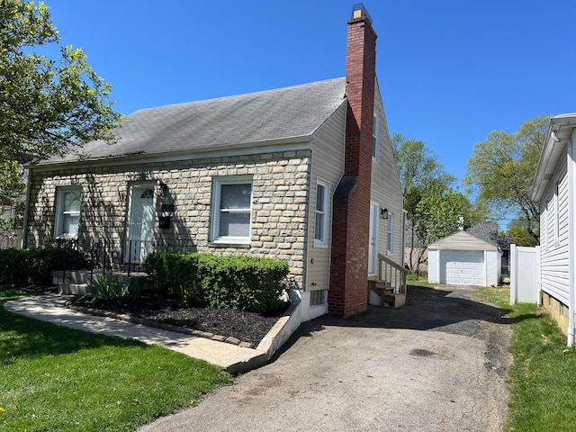 view of front of home featuring an outbuilding and a garage