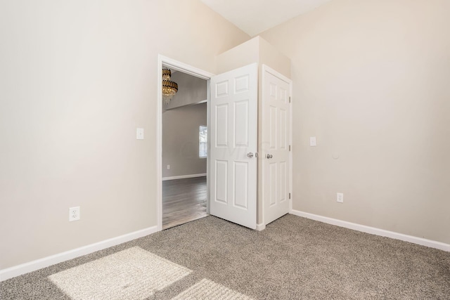 unfurnished bedroom featuring carpet flooring and a closet