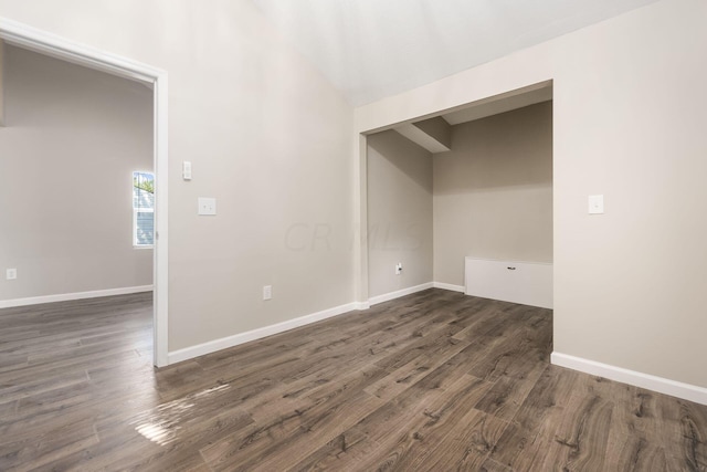 spare room featuring dark hardwood / wood-style flooring