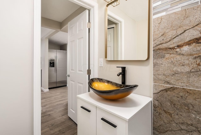 bathroom featuring vanity and hardwood / wood-style flooring