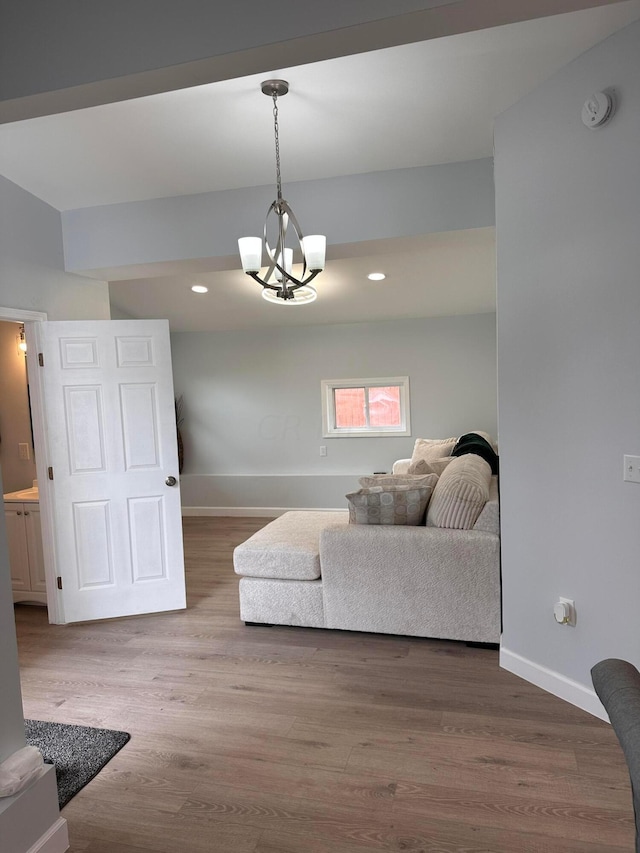 living room with a chandelier and hardwood / wood-style flooring