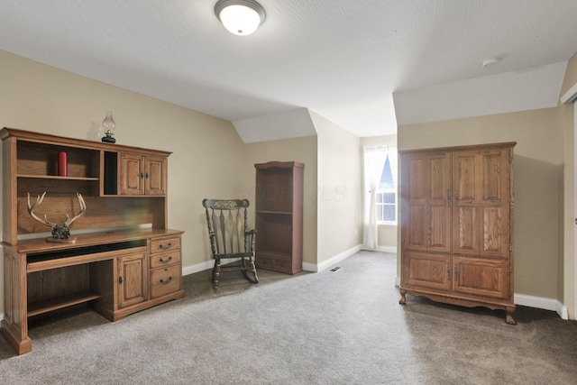 office space featuring lofted ceiling and carpet flooring