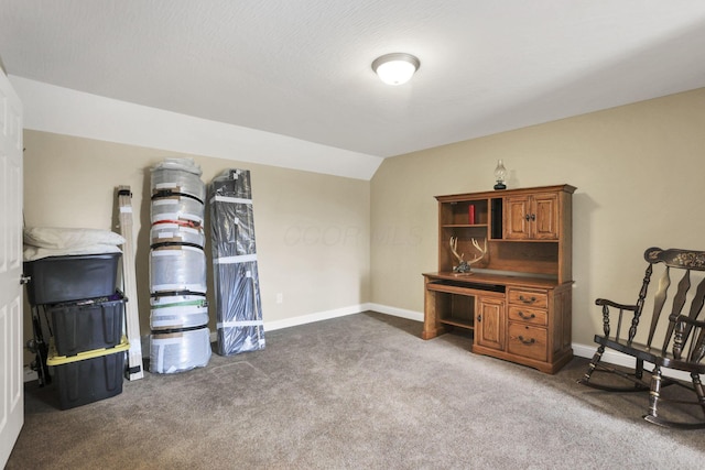 sitting room with carpet flooring and vaulted ceiling