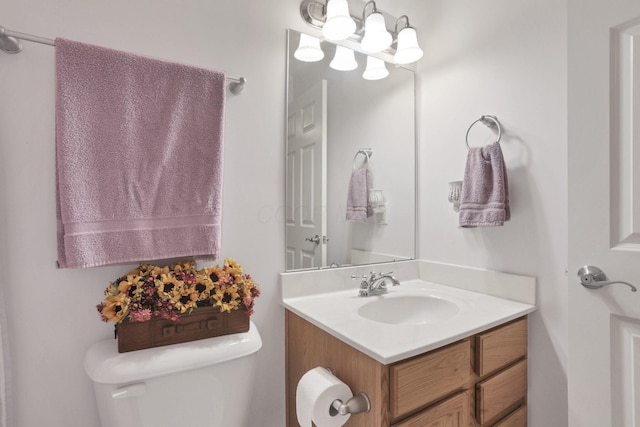 bathroom with toilet and vanity