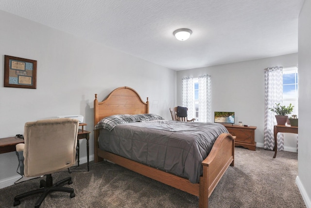 carpeted bedroom with a textured ceiling