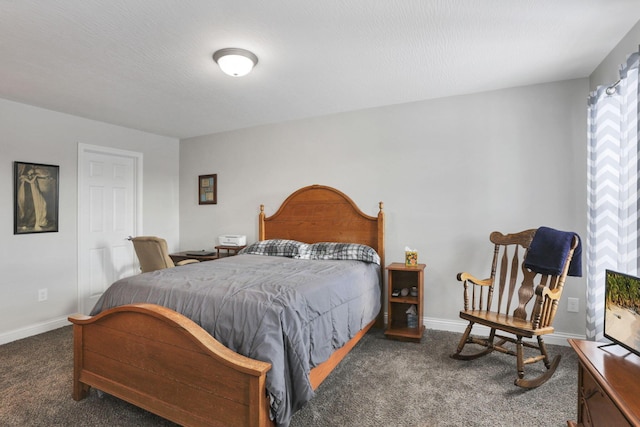 bedroom featuring dark carpet