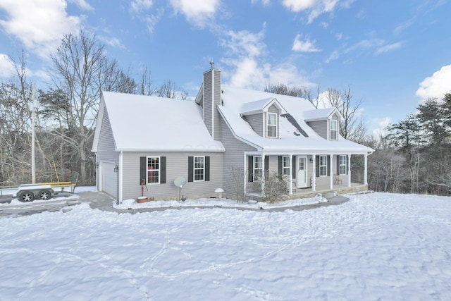 cape cod-style house featuring a garage and a porch