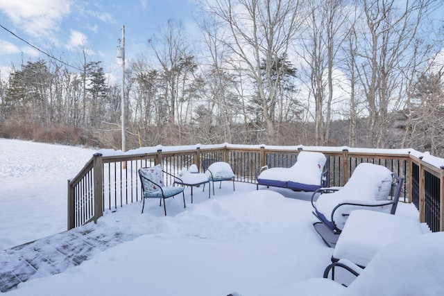 view of snow covered deck