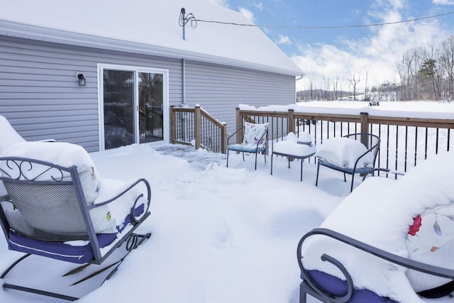 view of snow covered deck