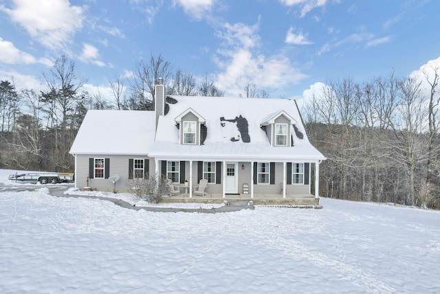 cape cod-style house featuring a porch