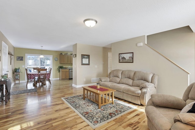 living room with light hardwood / wood-style flooring