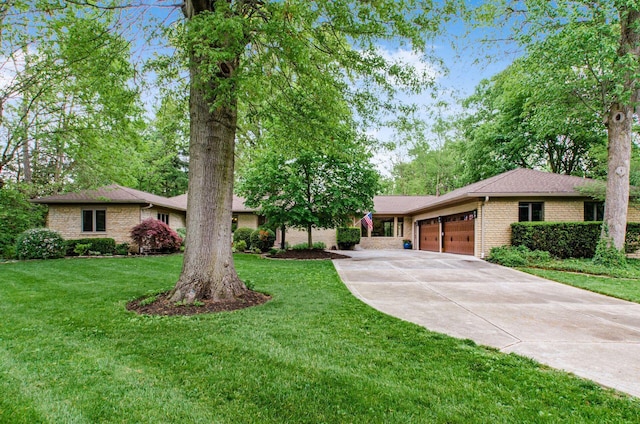 single story home with a garage and a front yard